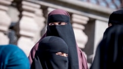 DENMARK -- Women wearing the niqab exit the Danish Parliament at Christiansborg Castle in Copenhagen, May 31, 2018